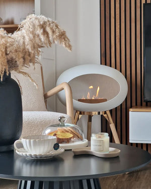Freestanding Le Feu fireplace styled in a modern condo living room, showing versatile design that fits any space.