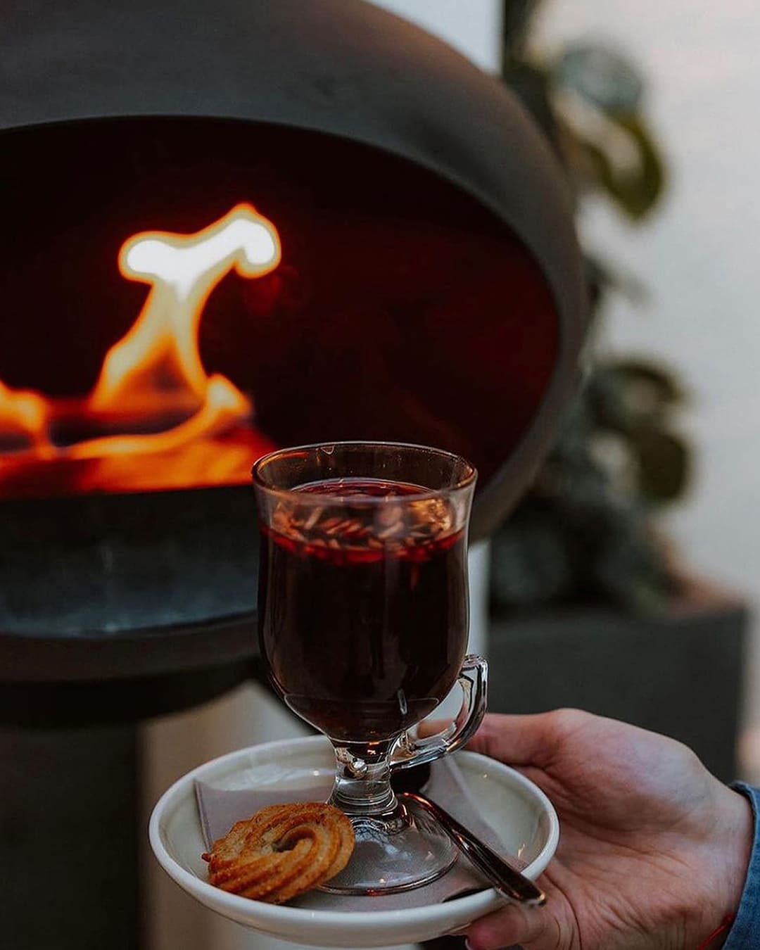 Freestanding Le Feu fireplace styled in a modern condo living room, showing versatile design that fits any space.